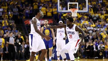 OAKLAND, CALIFORNIA - APRIL 24: Patrick Beverley #21 of the LA Clippers congratulates Lou Williams #23 of the LA Clippers after he made a basket against the Golden State Warriors during Game Five of the first round of the 2019 NBA Western Conference Playoffs at ORACLE Arena on April 24, 2019 in Oakland, California. NOTE TO USER: User expressly acknowledges and agrees that, by downloading and or using this photograph, User is consenting to the terms and conditions of the Getty Images License Agreement. Ezra Shaw/Getty Images/AFP
== FOR NEWSPAPERS, INTERNET, TELCOS & TELEVISION USE ONLY ==