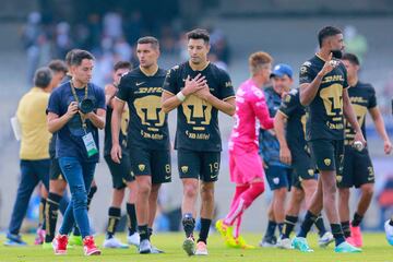 Molina (C) and Diogo De Oliveira (R) of Pumas celebrate 