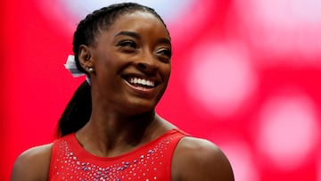 FILE PHOTO: Simone Biles smiles at a teammate during the final day of women's competition in the U.S. Olympic Team Trials for gymnastics in St. Louis, Missouri, U.S., June 27, 2021. REUTERS/Lindsey Wasson/File Photo