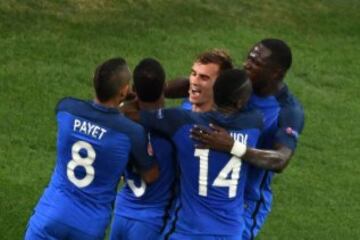 Griezmann is mobbed after putting France in front.