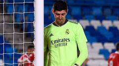 (FILES) Real Madrid's Belgian goalkeeper Thibaut Courtois reacts to Sevilla's second goal scored by Sevilla's Croatian midfielder Ivan Rakitic during the Spanish League football match between Real Madrid CF and Sevilla FC at the Alfredo di Stefano stadium in Valdebebas, on the outskirts of Madrid on May 9, 2021. Real Madrid's goalkeeper Thibaut Courtois has ruptured the anterior cruciate ligament in his left knee on the eve of the new season in La Liga, his club announced on August 10, 2023. (Photo by PIERRE-PHILIPPE MARCOU / AFP)