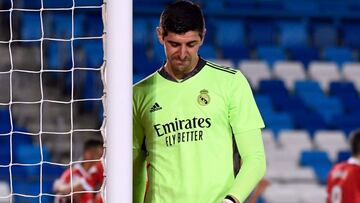 (FILES) Real Madrid's Belgian goalkeeper Thibaut Courtois reacts to Sevilla's second goal scored by Sevilla's Croatian midfielder Ivan Rakitic during the Spanish League football match between Real Madrid CF and Sevilla FC at the Alfredo di Stefano stadium in Valdebebas, on the outskirts of Madrid on May 9, 2021. Real Madrid's goalkeeper Thibaut Courtois has ruptured the anterior cruciate ligament in his left knee on the eve of the new season in La Liga, his club announced on August 10, 2023. (Photo by PIERRE-PHILIPPE MARCOU / AFP)