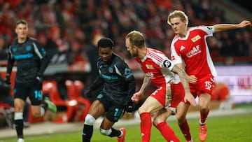 Bayer Leverkusen's English midfielder #19 Nathan Tella (2L) and Union Berlin's German defender #02 Kevin Vogt (2R) vie for the ball during the German first division Bundesliga football match between 1 FC Union Berlin and Bayer 04 Leverkusen in Berlin, on November 30, 2024. (Photo by Odd ANDERSEN / AFP) / DFL REGULATIONS PROHIBIT ANY USE OF PHOTOGRAPHS AS IMAGE SEQUENCES AND/OR QUASI-VIDEO
