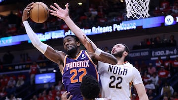 NEW ORLEANS, LOUISIANA - APRIL 24: Deandre Ayton #22 of the Phoenix Suns rebounds the ball against Larry Nance Jr. #22 of the New Orleans Pelicans during the first half of Game Four of the Western Conference First Round at the Smoothie King Center on April 24, 2022 in New Orleans, Louisiana.