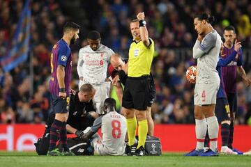 Naby Keita receives treatment during the Champions League semi-final at Camp Nou.