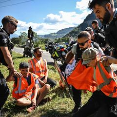 Why were the activists who blocked stage 10 of the Tour de France protesting?