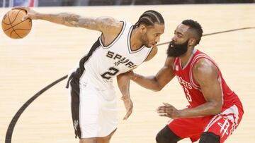 Mar 6, 2017; San Antonio, TX, USA; San Antonio Spurs small forward Kawhi Leonard (2) is defended by Houston Rockets shooting guard James Harden (13) during the second half at AT&T Center. Mandatory Credit: Soobum Im-USA TODAY Sports