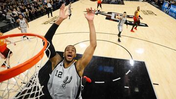 Mar 23, 2018; San Antonio, TX, USA; San Antonio Spurs power forward LaMarcus Aldridge (12) reaches for a rebound during the first half against the Utah Jazz at AT&T Center. Mandatory Credit: Soobum Im-USA TODAY Sports TPX IMAGES OF THE DAY