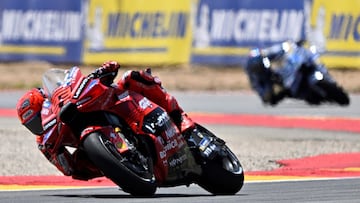 Team Ducati Lenovo Team's Marc Marquez rides ahead of Team Gresini Racing MotoGP's Alex Marquez (R) during the sprint race of the MotoGP Aragon Grand Prix at the Motorland circuit in Alcaniz, northeastern Spain, on June 7, 2025. (Photo by JOSE JORDAN / AFP)