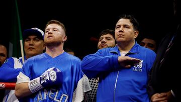Boxing - Saul 'Canelo' Alvarez vs William Scull - Undisputed Super Middleweight Championship - ANB Arena, Riyadh, Saudi Arabia - May 3, 2025 Saul 'Canelo' Alvarez and his coach Eddy Reynoso during the national anthems ahead of his super middleweight fight against William Scull REUTERS/Hamad I Mohammed