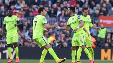 Getafe's Spanish forward Angel Rodriguez (R) celebrates with Getafe's Spanish forward Jaime Mata after scoring during the Spanish league football match between FC Barcelona and Getafe CF at the Camp Nou stadium in Barcelona on February 15, 2020.