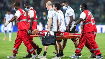 Comoros' goalkeeper Salim Ben Boina (C) is brought off on a stretcher after an injury during the Group C Africa Cup of Nations (CAN) 2021 football match between Ghana and Comoros at Stade Roumde Adjia in Garoua on January 18, 2022. (Photo by Daniel