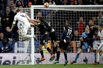 Ramos (left) heads in the winner against Deportivo.