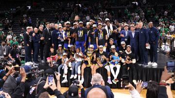 BOSTON, MA - JUNE 16: The Golden State Warriors pose for a photo with The Larry OBrien Trophy and The Bill Russell NBA Finals MVP Award after Game Six of the 2022 NBA Finals on June 16, 2022 at TD Garden in Boston, Massachusetts. NOTE TO USER: User expressly acknowledges and agrees that, by downloading and or using this photograph, user is consenting to the terms and conditions of Getty Images License Agreement. Mandatory Copyright Notice: Copyright 2022 NBAE (Photo by Joe Murphy/NBAE via Getty Images)