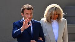 LE TOUQUET-PARIS-PLAGE, FRANCE - APRIL 24: Emmanuel Macron salutes voters as he leaves his house with Brigitte Macron to go vote on April 24, 2022 in Le Touquet-Paris-Plage, France. Emmanuel Macron and Marine Le Pen were both qualified on Sunday April 10th for France's 2022 presidential election second round to be held on April 24. This is the second consecutive time the two candidates face-off in the final round of elections. (Photo by Aurelien Meunier/Getty Images)