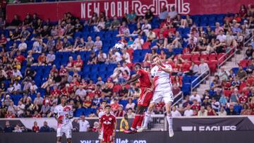 Jul 22, 2023; Harrison, NJ, USA; New York Red Bulls midfielder Dru Yearwood (16) fights for a headed ball against New England Revolution defender Dave Romney (2) during the second half at Red Bull Arena. Mandatory Credit: Mark Smith-USA TODAY Sports