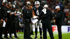 LONDON, ENGLAND - OCTOBER 14:  Derek Carr #4 of the Oakland Raiders speaks with head coach Jon Gruden during a timeout in the NFL International Series game between Seattle Seahawks and Oakland Raiders at Wembley Stadium on October 14, 2018 in London, England.  (Photo by Dan Istitene/Getty Images)