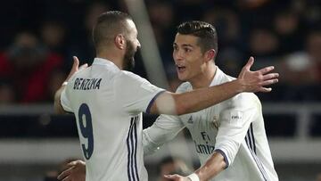 Real Madrid forward Cristiano Ronaldo celebrates scoring a goal with Karim Benzema.