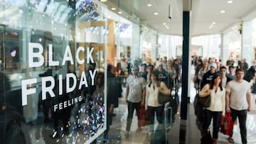 FILE PHOTO: People walk through the King of Prussia mall, one of the largest retail malls in the U.S., on Black Friday, a day that kicks off the holiday shopping season, in King of Prussia, Pennsylvania, U.S., November 29, 2019. REUTERS/Sarah Silbiger/File Photo