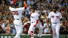 BOSTON, MA - JULY 12: Mookie Betts #50 of the Boston Red Sox reacts with Eduardo Nunez #36, Jackie Bradley Jr. #19, and Sandy Leon #3 after hitting a grand slam home run during the fourth inning of a game against the Toronto Blue Jays on July 12, 2018 at Fenway Park in Boston, Massachusetts. (Photo by Billie Weiss/Boston Red Sox/Getty Images)