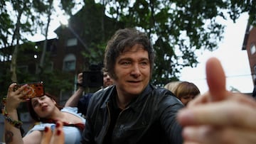 Argentina's President Javier Milei greets supporters during a La Libertad Avanza party rally ahead of the October 26 midterm elections, seen as crucial for his administration after U.S. President Donald Trump warned that future support for Argentina would depend on Milei's party performing well in the vote, in Tres de Febrero, on the outskirts of Buenos Aires, Argentina, October 17, 2025. REUTERS/Matias Baglietto