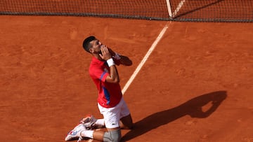 PARIS, FRANCE - AUGUST 04: Novak Djokovic of Team Serbia celebrates match point during the Men's Singles Gold medal match against Carlos Alcaraz of Team Spain on day nine of the Olympic Games Paris 2024 at Roland Garros on August 04, 2024 in Paris, France. (Photo by Matthew Stockman/Getty Images)