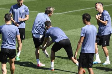 Larking around, Cristaino pulls Coentrao's shorts down in training.