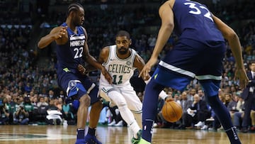Jan 5, 2018; Boston, MA, USA; Boston Celtics guard Kyrie Irving (11) drives past Minnesota Timberwolves forward Andrew Wiggins (22) during the second half of Boston's 91-84 win at TD Garden. Mandatory Credit: Winslow Townson-USA TODAY Sports