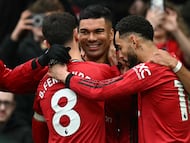 Manchester United's Brazilian midfielder #18 Casemiro (C) celebrates with teammates after scoring the team's first goal during the English Premier League football match between Manchester United and Fulham at Old Trafford in Manchester, north west England, on February 1, 2026. (Photo by Paul ELLIS / AFP) / RESTRICTED TO EDITORIAL USE. No use with unauthorized audio, video, data, fixture lists, club/league logos or 'live' services. Online in-match use limited to 120 images. An additional 40 images may be used in extra time. No video emulation. Social media in-match use limited to 120 images. An additional 40 images may be used in extra time. No use in betting publications, games or single club/league/player publications. /
