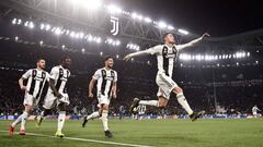 Juventus&#039; Portuguese forward Cristiano Ronaldo (R) celebrates after scoring 3-0 during the UEFA Champions League round of 16 second-leg football match Juventus vs Atletico Madrid on March 12, 2019 at the Juventus stadium in Turin. (Photo by Marco BER