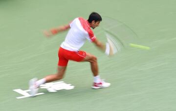 Novak Djokovic returns to Kevin Anderson at the Shanghai Masters.