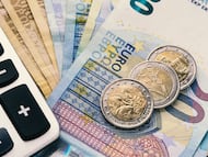 Close up of a calculator and euro money in a financial analyzing concept