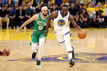 Draymond Green dribbles against the Boston Celtics' Derrick White during Game 1 on Thursday.