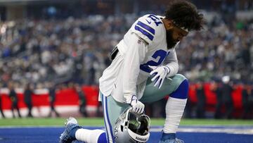 ARLINGTON, TEXAS - DECEMBER 09: Ezekiel Elliott #21 of the Dallas Cowboys kneels in the end zone before the game against the Philadelphia Eagles at AT&amp;T Stadium on December 09, 2018 in Arlington, Texas.   Richard Rodriguez/Getty Images/AFP
 == FOR NEWSPAPERS, INTERNET, TELCOS &amp; TELEVISION USE ONLY ==