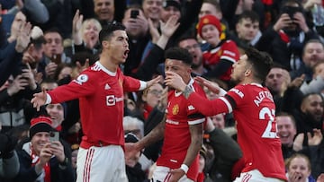 Soccer Football - Premier League - Manchester United v Tottenham Hotspur - Old Trafford, Manchester, Britain - March 12, 2022 Manchester United's Cristiano Ronaldo celebrates scoring their first goal with Jadon Sancho and Alex Telles REUTERS/Phil Noble EDITORIAL USE ONLY. No use with unauthorized audio, video, data, fixture lists, club/league logos or 'live' services. Online in-match use limited to 75 images, no video emulation. No use in betting, games or single club /league/player publications. Please contact your account representative for further details.