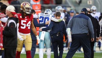 SANTA CLARA, CALIFORNIA - JANUARY 22: Tony Pollard #20 of the Dallas Cowboys is assisted by medical staff after suffering an injury against the San Francisco 49ers during the second quarter in the NFC Divisional Playoff game at Levi's Stadium on January 22, 2023 in Santa Clara, California.   Lachlan Cunningham/Getty Images/AFP (Photo by Lachlan Cunningham / GETTY IMAGES NORTH AMERICA / Getty Images via AFP)