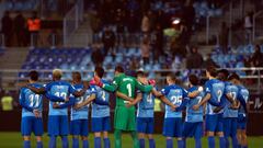 Malaga players observe a minute of silence for former Spanish footbal star Enrique Castro &quot;Quini&quot; who died on February 27, 2018, before the Spanish league football match Malaga CF against Sevilla FC at La Rosaleda stadium in Malaga on February 2