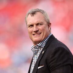 Who is John Lynch? What NFL team did he play for? What’s his annual salary?