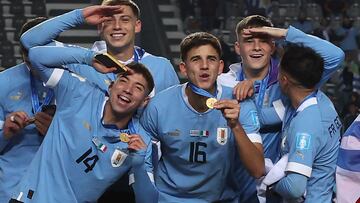 Players of Uruguay celebrate on the podium after defeating Italy and winning the Argentina 2023 U-20 World Cup at the Estadio Unico Diego Armando Maradona stadium in La Plata, Argentina, on June 11, 2023. (Photo by Alejandro PAGNI / AFP)