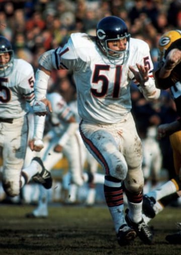 Linebacker. Jugó en Chicago Bears de 1965 a 1973, y se retiró forzado por múltiples lesiones de rodilla. Ingresó en el Hall of Fame de la NFL en 1979. Su número, el 51, fue retirado por los Bears.