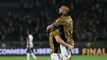 Colo-Colo's midfielder Arturo Vidal celebrates witha teamate after winning the Copa Libertadores