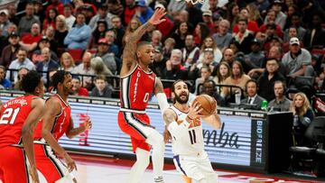 Ricky Rubio penetra a canasta ante la defensa de Damian Lillard en el partido de la NBA que ha enfrentado a los Portland Trail Blazers y a los Phoenix Suns