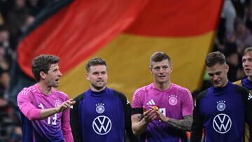 (L-R) Germany's forward #13 Thomas Mueller, Germany's defender #18 Maxmilian Mittelstadt, Germany's midfielder #08 Toni Kroos and Germany's midfielder #06 Joshua Kimmich react after the friendly football match between Germany and Netherlands in Frankfurt, western Germany, on March 26, 2024. (Photo by Kirill KUDRYAVTSEV / AFP)