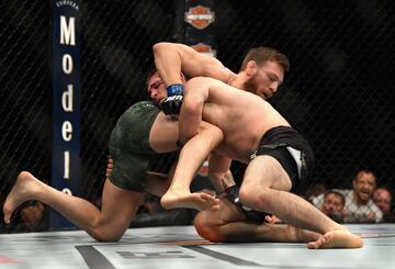 LAS VEGAS, NV - OCTOBER 06: Conor McGregor of Ireland tackles Khabib Nurmagomedov of Russia in their UFC lightweight championship bout during the UFC 229 event inside T-Mobile Arena on October 6, 2018 in Las Vegas, Nevada.   Harry How/Getty Images/AFP
== FOR NEWSPAPERS, INTERNET, TELCOS & TELEVISION USE ONLY ==