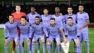 (TOP L to R) Real Madrid's Ukrainian goalkeeper Andriy Lunin, Real Madrid's French defender Aurelien Tchouameni, Real Madrid's Spanish midfielder Marco Asensio, Real Madrid's French midfielder Eduardo Camavinga, Real Madrid's Spanish midfielder Dani Ceballos, Real Madrid's Brazilian defender Eder Militao, (BOTTOM L to R) Real Madrid's Spanish forward Lucas Vazquez, Real Madrid's Spanish defender Alvaro Odriozola, Real Madrid's Brazilian forward Rodrygo, Real Madrid's Spanish defender Nacho Fernandez and Real Madrid's Belgian forward Eden Hazard pose prior to the Spain's Copa del Rey (King's Cup) round of 32, first leg, footbal match between CP Cacereno and Real Madrid CF at the Principe Felipe stadium in Caceres, on January 3, 2023. (Photo by CRISTINA QUICLER / AFP)
