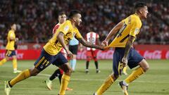 Atletico de Madrid&#039;s Uruguayan defender Jose Gimenez (R) celebrates with Atletico de Madrid&#039;s Argentinian forward Angel Correa after scoring during the Spanish league football match Girona FC vs Club Atletico de Madrid at the Municipal de Montil