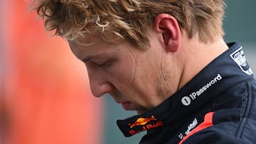 (FILES) Red Bull Racing's New Zealand driver Liam Lawson walks back to his team garage after getting out of his car at the end of the Formula One Chinese Grand Prix in Shanghai on March 23, 2025. Red Bull said on March 27, 2025 that Liam Lawson has been axed and replaced by Yuki Tsunoda, confirming days of speculation and just two race weekends into the F1 season. (Photo by GREG BAKER / AFP)