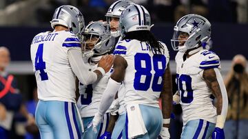 ARLINGTON, TEXAS - NOVEMBER 30: Wide receiver Brandin Cooks #3 of the Dallas Cowboys is congratulated by quarterback Dak Prescott #4, wide receiver CeeDee Lamb #88 and running back Tony Pollard #20 after making a catch for a touchdown during the 2nd quarter of the game against the Seattle Seahawks at AT&T Stadium on November 30, 2023 in Arlington, Texas. (Photo by Ron Jenkins/Getty Images)