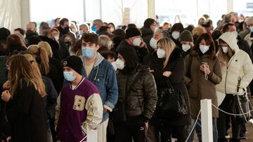 People wait to receive coronavirus disease (COVID-19) vaccines inside the Mostra d'Oltremare vaccination centre in Naples, Italy, January, 8 2022. REUTERS/Ciro De Luca