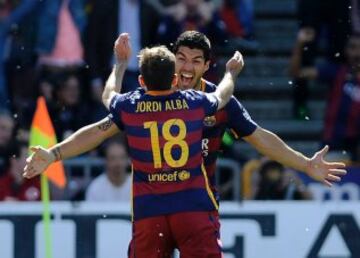 Luis Suárez celebrates with Jordi Alba after the opening goal.
